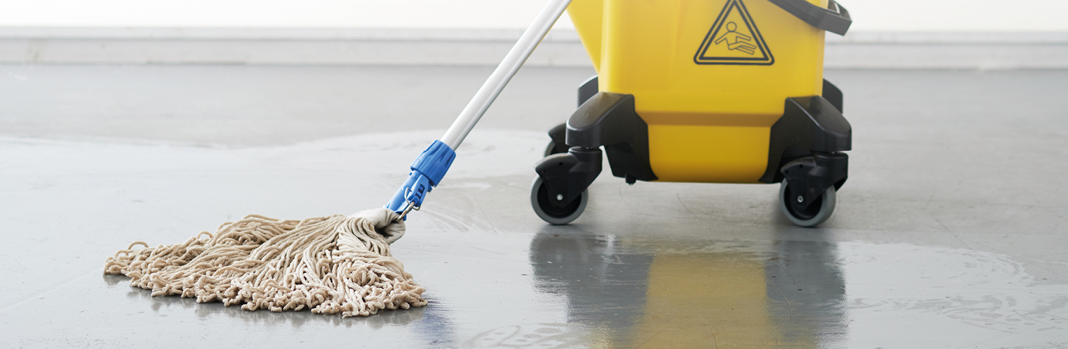 Kentucky mop bucket and mop on a floor