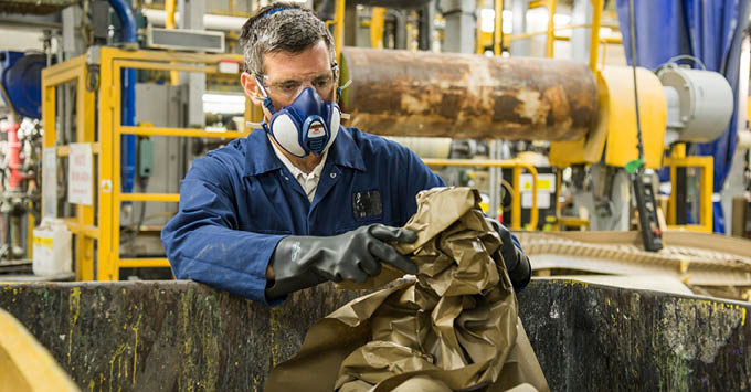 Man wearing a mask in a warehouse
