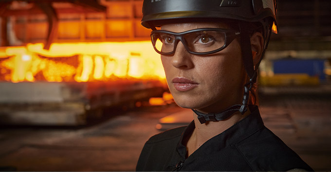 woman wearing a safety helmet and glasses