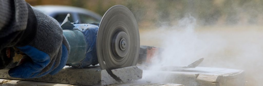 Circular saw cutting through piece of material