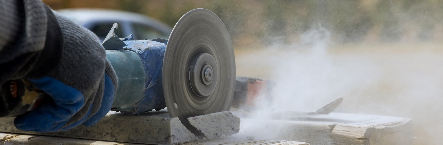 Circular saw cutting through piece of material