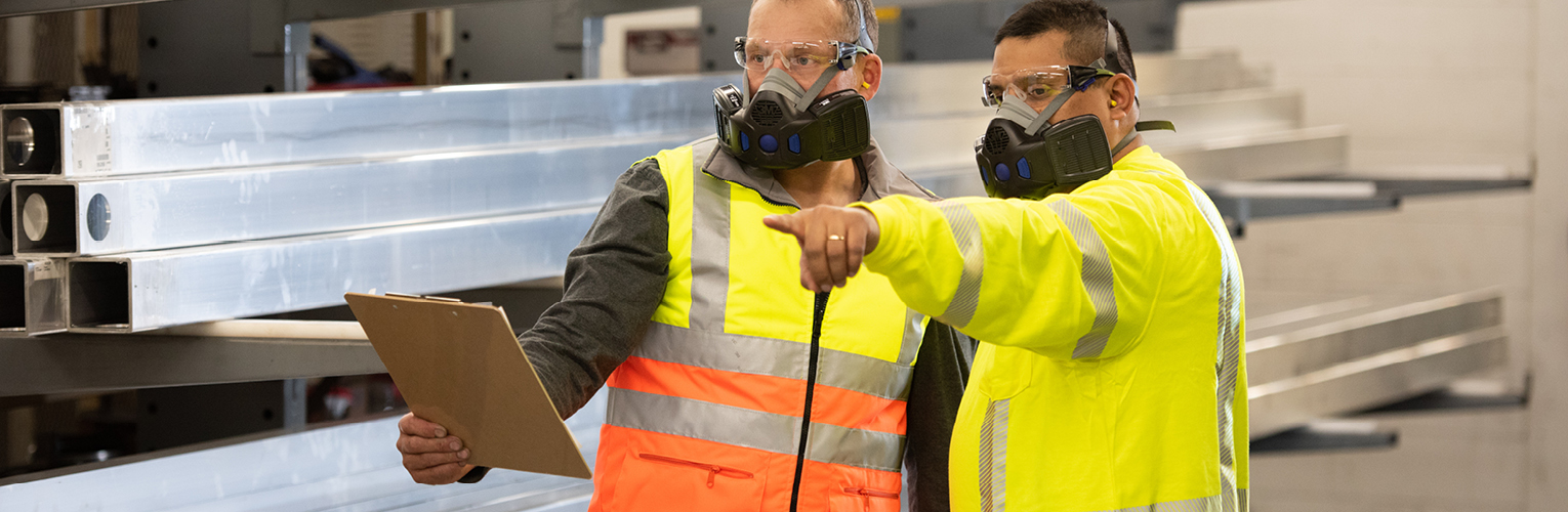 Men wearing respirators at work