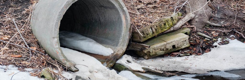 waste pipe leading into a river