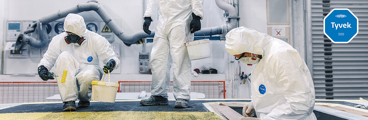 Workers wearing DuPont coveralls