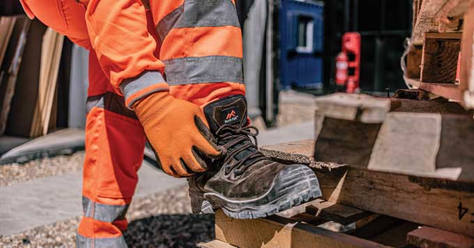 Man wearing Hi Vis and safety boots