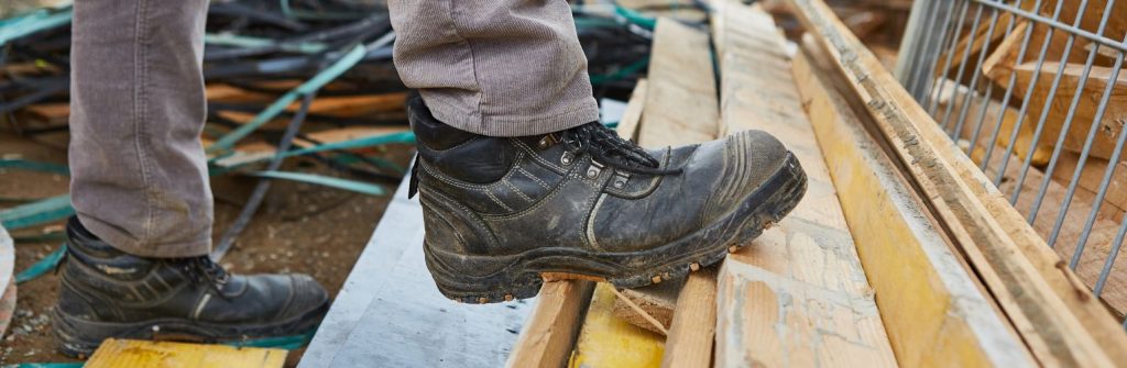 Safety boot on a piece of wood