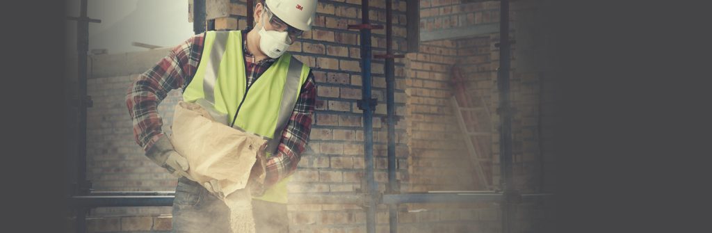 A man pouring dust in PPE